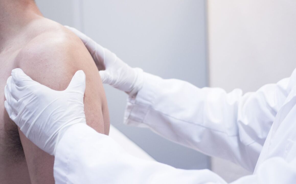 The doctor examines the shoulder for arthritis